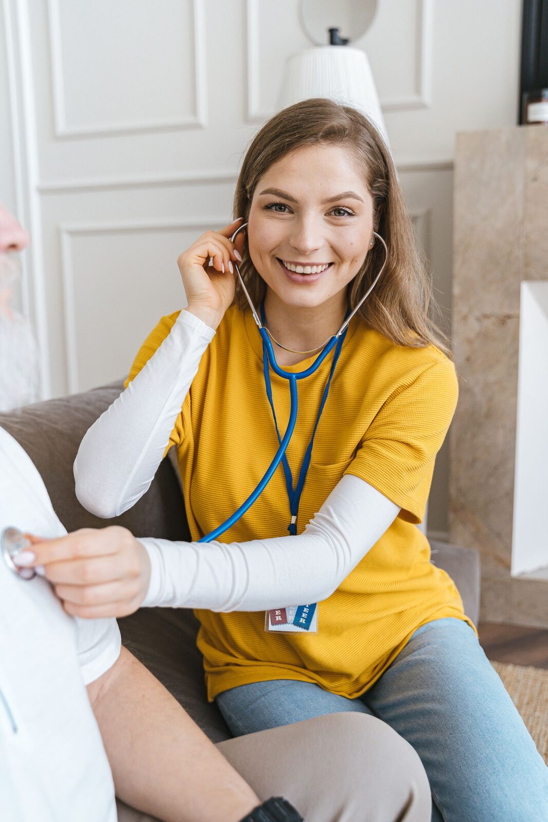 A smiling nurse with a stethoscope